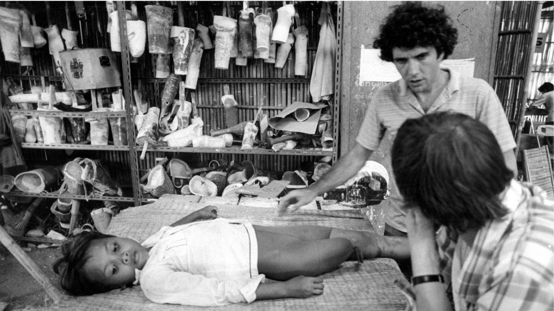 Doctor Claude Simonnot looks after Gniep, a child whose leg has been amputated 
